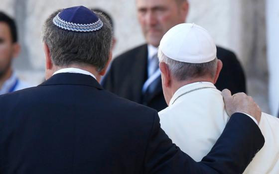 Rabbi Abraham Skorka of Buenos Aires, Argentina, and Pope Francis embrace after visiting the Western Wall in Jerusalem May 26, 2014. (CNS/Paul Haring)