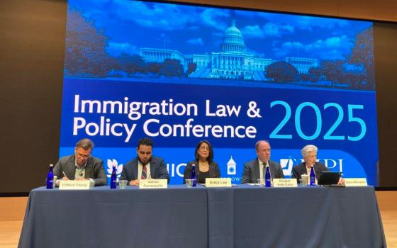 Five panelists take part in the Immigration Law and Policy Conference at Georgetown University in Washington Oct 9, 2025.