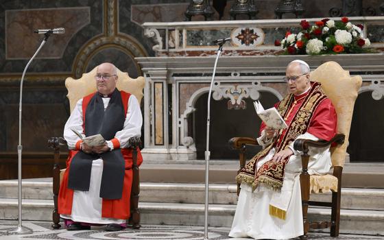 Pope Leo XIV and Anglican Archbishop Stephen Cottrell of York, England, left, lead midday prayer with Britain's King Charles III and Queen Camilla in the Sistine Chapel at the Vatican Oct. 23, 2025. (CNS/Vatican Media)