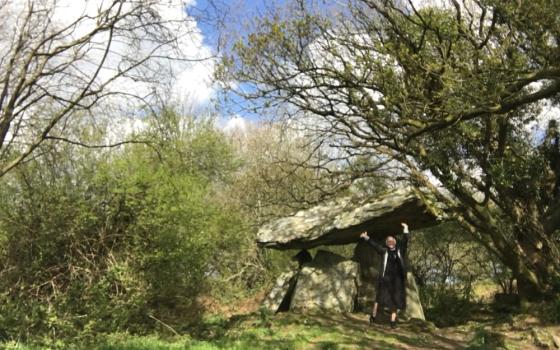 The author at Gaulstown Portal Dolmen, a megalithic portal tomb in County Waterford, Ireland, in April 2021 (Courtesy of Kathryn Press)