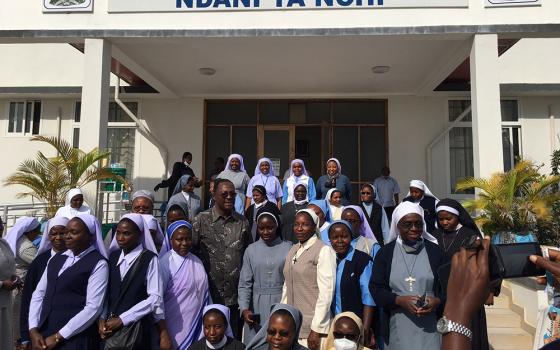 A delegation of sisters and workshop facilitators stands with George Simbachawene, minister of home affairs of Tanzania. (Courtesy of Sr. Eucharia Madueke)