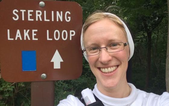 Sr. Kathryn Press stands at a trailhead in New York's Sterling Forest State Park in the Ramapo Mountains (Courtesy of Kathryn Press)