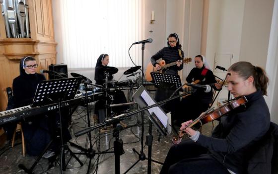 The music group of St. Joseph of Saint-Marc convent in Mukachevo, Ukraine, is made up of, from left, Sister Laura (keyboard), Sister Erika (drums), Sister Christina (guitar), Sister Marina (vocals) and Sister Natalka (violin). 