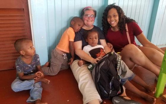 Mercy Sr. Jennifer Wilson, center, with Mount Mercy Academy student Anani Debose, right, on a service trip to Guyana in 2019 (Courtesy of Jennifer Wilson)