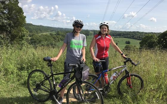 Sr. Chris Kunze, left, and Sr. Lisa Polega, both Sisters of Charity of Nazareth, pause while riding the Parklands of Floyds Fork in Kentucky. (Courtesy of Cycling With Sisters)