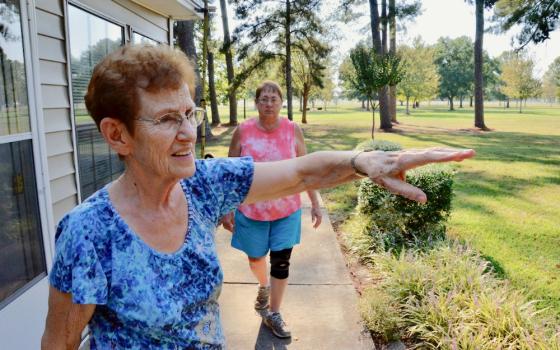 Dwelling Place Sr. Clare Van Lent shows the grounds of the community's retreat center in Brooksville, Mississippi, in September 2019. Behind her is Sr. Mary Horrell. (GSR photo / Dan Stockman)