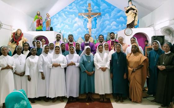 The sisters of the Home Mission project with Auxiliary Bishop Christudas Rajappan of Trivandrum Latin Archdiocese (middle, back row) with Fr. Michael Thomas (left of Rajappan), who launched the project (Courtesy of Felcy Mangalath)