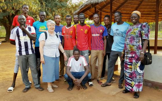 Sr. Joan Mumaw, standing front, with Sr. Esperance Bamiriyo, principal of the Catholic Health Training Institute in Wau, South Sudan, and a Comboni Missionary Sister, right, with 2019 graduates of the institute (Courtesy of Solidarity with South Sudan)