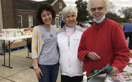 Julia Gerwe, left, embraces her call to serve with Srs. Susan Gatz, center, and Rosemarie Kirwan, at a November 2021 food distribution site in Nelson County, Kentucky, home of the Sisters of Charity of Nazareth. (Courtesy of Danielle Hagler)