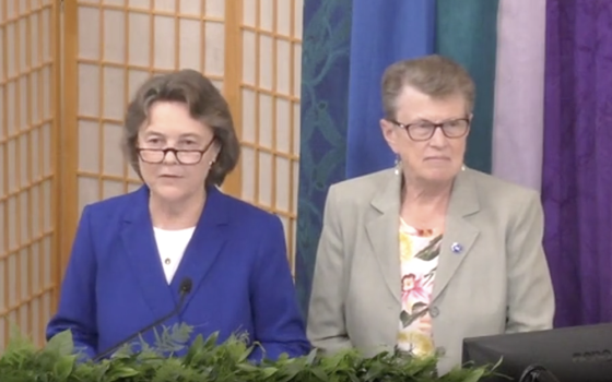 Immaculate Heart of Mary Sr. Jane Herb, right, the president-elect of the Leadership Conference of Women Religious, joins Dominican Sr. Elise García, LCWR president, to ask for forgiveness for racism in religious life at the end of García's presidential 