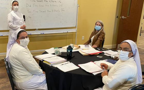 From left: Sr. Ignacia García Ramos, Sr. Guadalupe Martínez Castillo, instructor Kim Campbell, and Sr. Felipa Santos Tapia in a March class in English as a second language at Centro de San Juan Diego in Lexington, Kentucky. (Courtesy of Jim Bennett)