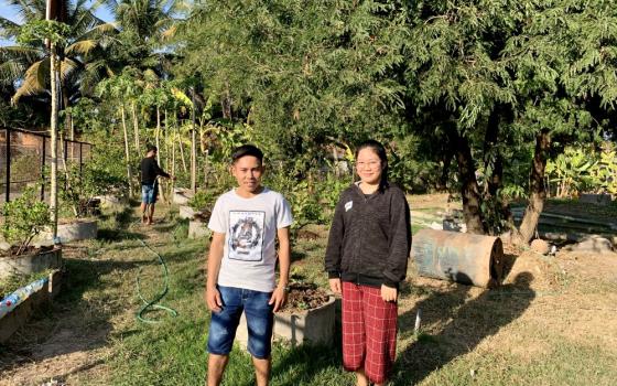 Students Phonexay Phomvihan, left, and Vanhny Sinsomboun, right, say they are grateful for the opportunity to live at the Nazareth Center and pursue vocational training in Vientiane, Laos. (Akarath Soukhaphon)