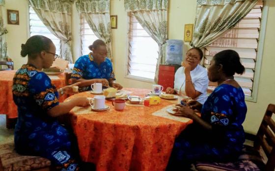 The Religious Sisters of Charity in Lagos, Nigeria, eat breakfast together while maintaining social distancing and avoiding physical contact. (Courtesy of the Religious Sisters of Charity)