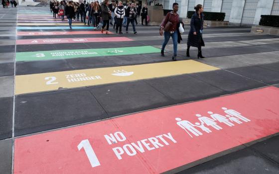 Phot of fhe entrance to the United Nations headquarters in New York displaying the world body's 17 sustainable development goals painted on the pavement (GSR photo/Chris Herlinger)