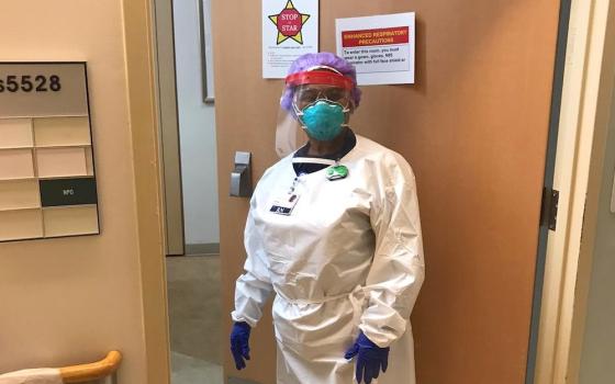 Sr. Vivien Echekwubelu, registered nurse and member of the Sisters of Notre Dame de Namur, in her protective gear on shift at a hospital in Baltimore, Maryland (Provided photo)