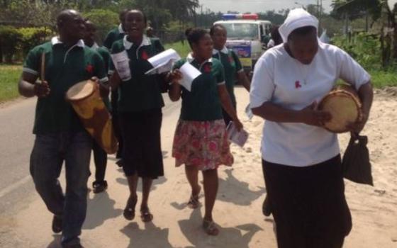 Sr. Freda Ehimuan (with drum) leads a prayer procession for World AIDS day in Kirikiri town, Lagos, Nigeria. (Courtesy of Sr. Freda Ehimuan)