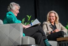 Sr. Joan Chittister and former Wyoming Republican Rep. Liz Cheney speak on the stage at the Bayfront Convention Center Oct. 17 in Erie, Pennsylvania. (NCR photo/Rick Klein)